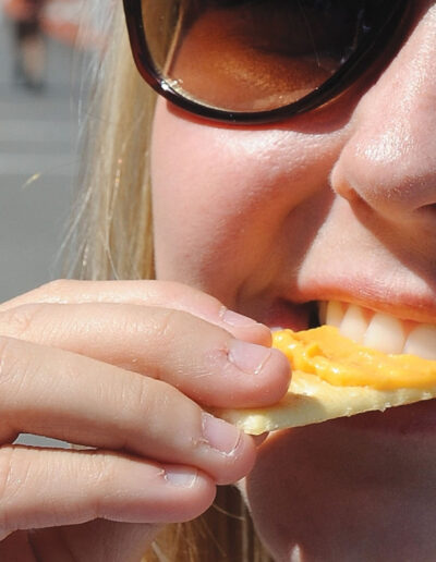 Individual eating beer cheese on a cracker in Winchester Kentucky, The Beer Cheese Capital of the World
